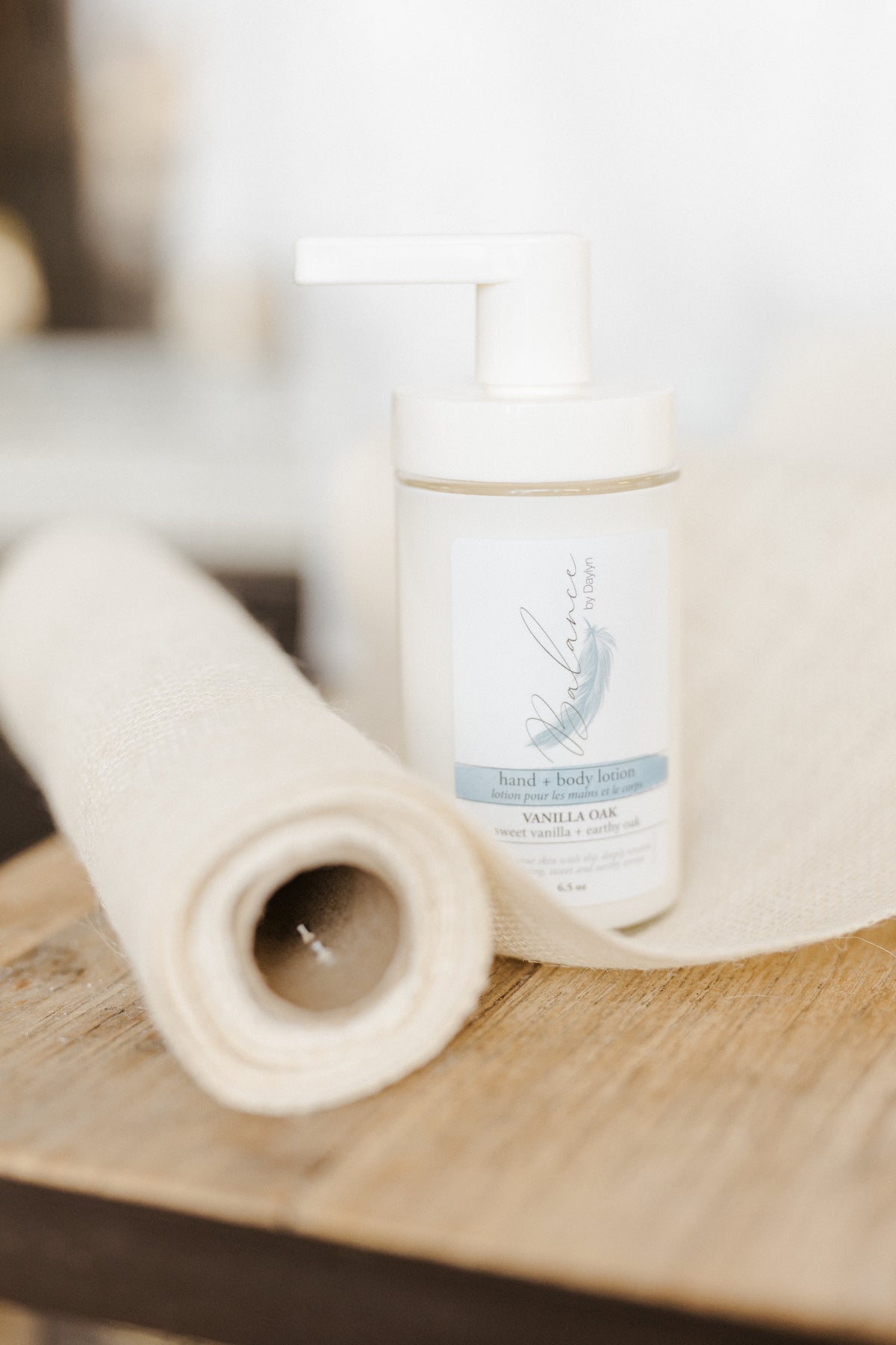 large bottle of vanilla oak hand and body lotion with a sweet and earthy scent
