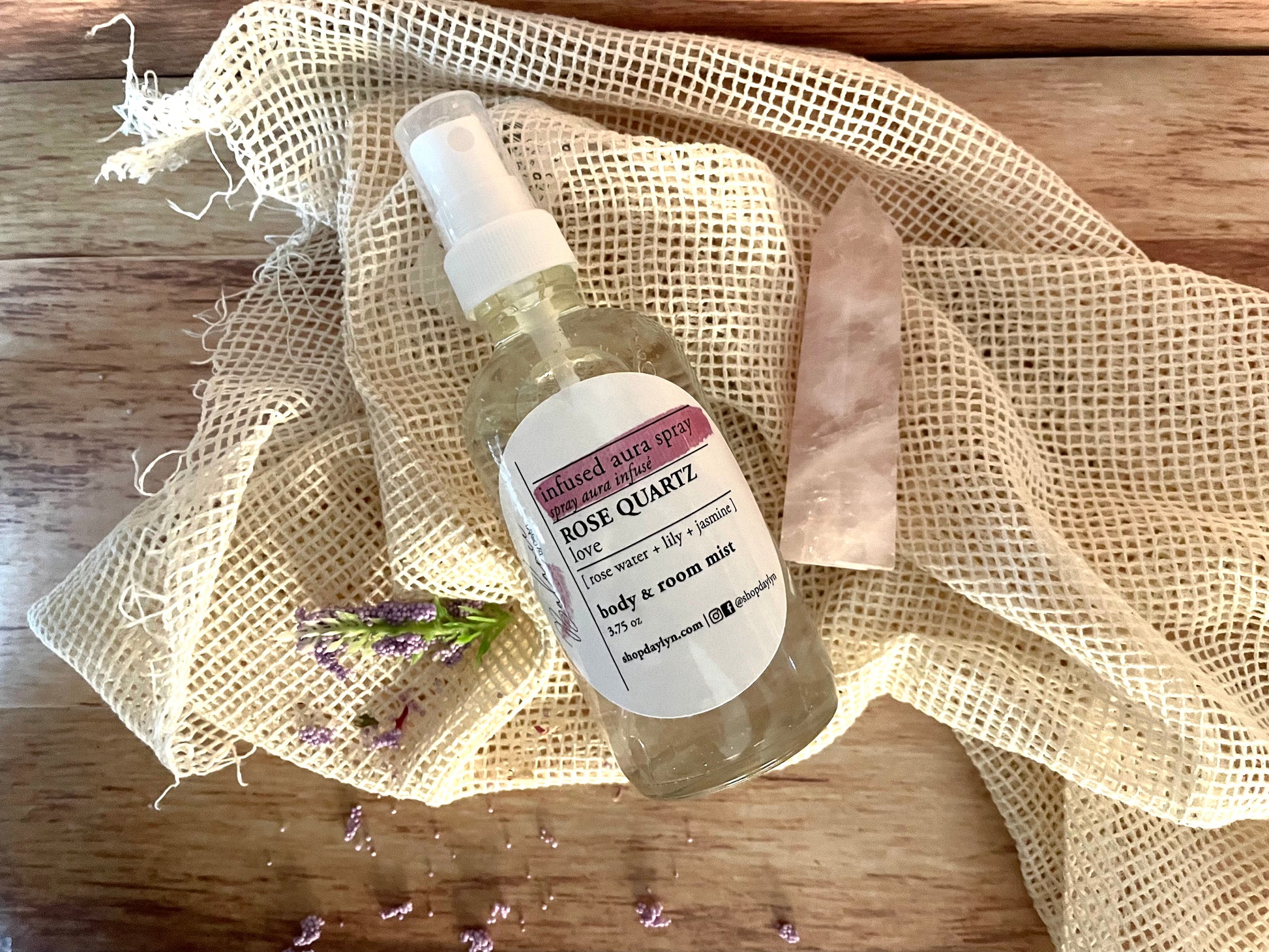 this rose quarts crystal infused aura spray is a divine mix of lily, jasmine, and rose scents to act as a body mist or aura setting spray