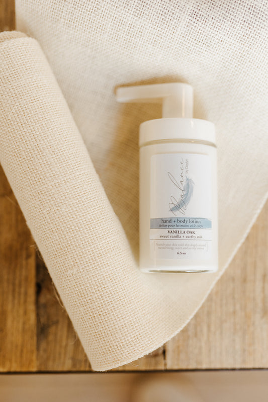 bottle of locally handcrafted vanilla oak hand and body lotion from balance by daylyn